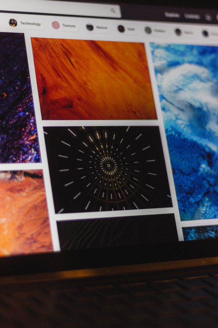 ours-journey Portable computer with website representing assorted abstract photos under favorites and browser search engine with magnifier symbol